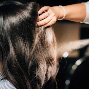 How to Use Hair Spray Without Weighing Hair Down